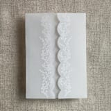 "White floral printed scallop edge vellum wrap for 5x7 card | pack of 10" - Invitation Jackets and Overlays in white by Ivory Invitations