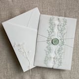 "Sage floral printed scallop edge vellum wrap for 5x7 card | pack of 10" - Invitation Jackets and Overlays in green by Ivory Invitations
