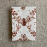"Venetian floral lace rust color printed vellum wrap for 5x7 card | pack of 10" - Invitation Jackets and Overlays in brown by Ivory Invitations