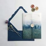 "Rustic Blue ombre forest landscape printed vellum wrap for 5x7 card  | pack of 10" - Invitation Jackets and Overlays in blue by Ivory Invitations