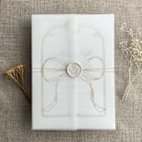 "Cashmere ribbon bow printed vellum wrap for 5x7 card | pack of 10" - Invitation Jackets and Overlays in beige by Ivory Invitations