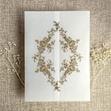 "Hazelnut print French floral crest vellum wrap for 5x7 card | pack of 10" - Invitation Jackets and Overlays in beige by Ivory Invitations
