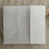 "Jessica white ink print minimalist flowers vellum wrap for 5x7 card | pack of 10" - Invitation Jackets and Overlays in white by Ivory Invitations