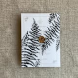"Black fern leaves greenery printed vellum wrap for 5x7 card  | pack of 10" - Invitation Jackets and Overlays in black by Ivory Invitations