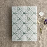 "Festive ribbon bow lattice sage printed vellum wrap for 5x7 card | pack of 10" - Invitation Jackets and Overlays in green by Ivory Invitations