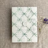 "Festive ribbon bow lattice sage printed vellum wrap for 5x7 card | pack of 10" - Invitation Jackets and Overlays in green by Ivory Invitations