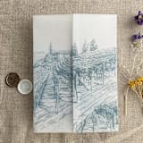 "Steel blue vineyard landscape sketch printed vellum wrap for 5x7 card | pack of 10" - Invitation Jackets and Overlays in blue by Ivory Invitations