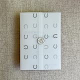 "Gray horseshoes vellum wrap for 5x7 card | pack of 10" - Invitation Jackets and Overlays in gray by Ivory Invitations