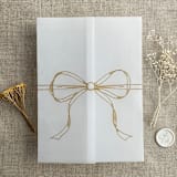 "Gold ribbon bow printed vellum wrap for 5x7 card | pack of 10" - Invitation Jackets and Overlays in gold by Ivory Invitations