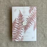 "Rosy mauve fern leaves greenery printed vellum wrap for 5x7 card  | pack of 10" - Invitation Jackets and Overlays in pink by Ivory Invitations