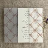 "Festive ribbon bow lattice rosy pink printed vellum wrap for 5x7 card | pack of 10" - Invitation Jackets and Overlays in pink by Ivory Invitations