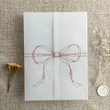 "Old rose ribbon bow printed vellum wrap for 5x7 card | pack of 10" - Invitation Jackets and Overlays in pink by Ivory Invitations