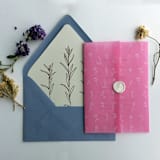 "Minimalist Endless flowers white ink print on pink garnet colored vellum wrap for 5x7 card | pack of 10" - Invitation Jackets and Overlays in pink by Ivory Invitations