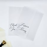 "Personalized Vellum Wrap with Couples Names (Set of 10)" - Invitation Jackets and Overlays in black by Caroline Russo