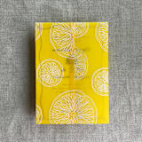 "White ink printed citrus celebration yellow vellum wraps for 5x7 card | pack of 10" - Invitation Jackets and Overlays in yellow by Ivory Invitations