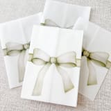 "Green bow watercolor vellum jacket | Set of 10" - Invitation Jackets and Overlays in green by Maria Ferrer G.