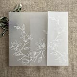 "White ink print Magnolia flowers vellum wrap for 5x7 card | pack of 10" - Invitation Jackets and Overlays in white by Ivory Invitations