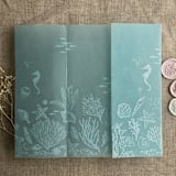 "Under the sea aqua blue colored vellum wrap for 5x7 card | pack of 10" - Invitation Jackets and Overlays in blue by Ivory Invitations