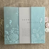 "Under the sea aqua blue colored vellum wrap for 5x7 card | pack of 10" - Invitation Jackets and Overlays in blue by Ivory Invitations