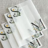 "Couple's initials with wildflowers vellum wraps for 5x7 invitations | Set of 10" - Invitation Jackets and Overlays in multicolorassorted-colors by Maria Ferrer G.