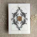 "Black print French floral crest vellum wrap for 5x7 card | pack of 10" - Invitation Jackets and Overlays in black by Ivory Invitations