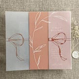 "Ginger ribbon bow printed vellum wrap for 5x7 card | pack of 10" - Invitation Jackets and Overlays in orange by Ivory Invitations