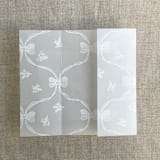 "White genie floral bows printed vellum wrap for 5x7 card | pack of 10" - Invitation Jackets and Overlays in white by Ivory Invitations