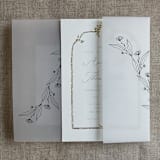 "Jessica black minimalist flowers printed vellum wrap for 5x7 card | pack of 10" - Invitation Jackets and Overlays in black by Ivory Invitations