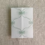 "Green genie floral bows printed vellum wrap for 5x7 card | pack of 10" - Invitation Jackets and Overlays in green by Ivory Invitations