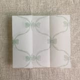 "Green genie floral bows printed vellum wrap for 5x7 card | pack of 10" - Invitation Jackets and Overlays in green by Ivory Invitations