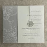 "White poinsettia vellum wrap for 5x7 card | pack of 10" - Invitation Jackets and Overlays in white by Ivory Invitations