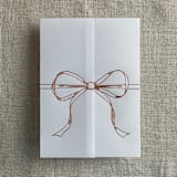 "Rose gold ribbon bow foil stamping vellum wrap for 5x7 card | pack of 10" - Invitation Jackets and Overlays in pink by Ivory Invitations