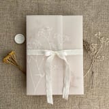 "White ink print minimalist baby's breath flower printed vellum wrap for 5x7 card  | pack of 10" - Invitation Jackets and Overlays in white by Ivory Invitations
