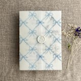 "Festive ribbon bow lattice sky blue printed vellum wrap for 5x7 card | pack of 10" - Invitation Jackets and Overlays in blue by Ivory Invitations