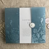 "Under the sea white ink printed on steel blue colored vellum wrap for 5x7 card  | pack of 10" - Invitation Jackets and Overlays in blue by Ivory Invitations