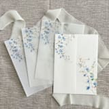 "Blue flowers and greenery vellum jacket for invitations | Set of 10" - Invitation Jackets and Overlays in blue by Maria Ferrer G.