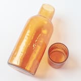 "Carafe Set - Amber" - Glassware in orange by Powered By People