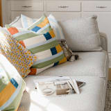 "Stamp Throw Pillow" - Throw Pillows in multicolor by Anchal