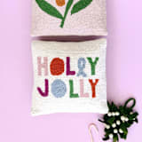 "Holly Jolly Hook Pillow" - Throw Pillows in multicolor by Ampersand Design Studio