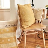 "Nira Ochre Handoom Pillow" - Throw Pillows in yellow by Anjali Purohit