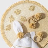 "Straw pompom napkin rings, natural, set of four" - Tabletop Accessories in natural by Joanna Buchanan