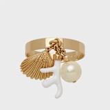 "Coral and shell skinny napkin rings, cream, set of four" - Tabletop Accessories in gold by Joanna Buchanan
