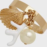 "Coral and shell skinny napkin rings, cream, set of four" - Tabletop Accessories in gold by Joanna Buchanan