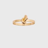 "Knot napkin rings, set of eight" - Tabletop Accessories in brass by Joanna Buchanan