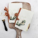 "Gold Gilded Mountain Vow Book | Set of 2 | Size 6x4.125" - Wedding Vow Books in multicolor by Clove and Cedar Design