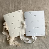 "Gold foil stamping baby bow ties vow books | SET of 2 books | includes 1 her vows and 1 his vows" - Wedding Vow Books in gold by Ivory Invitations