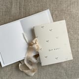 "Gold foil stamping baby bow ties vow books | SET of 2 books | includes 1 her vows and 1 his vows" - Wedding Vow Books in gold by Ivory Invitations