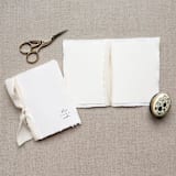 "Minimal Vow Books set of two bound with light taupe ribbon" - Wedding Vow Books in white by Jen Simpson
