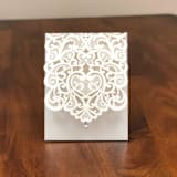 "Qty of 50 Ivory Shimmer Exquisite Laser Cut Pocket" - Invitation Pockets in white by Papel Custom Design
