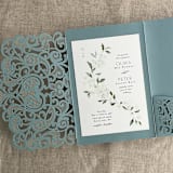 "Dust Blue Lace Lasercut Pocket | Pack of 10 | Envelopes Included" - Invitation Pockets in blue by Ivory Invitations
